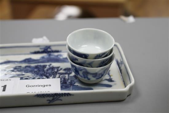 Six 19th century Chinese blue and white horses tea bowls and a later blue and white tray, length 16cm